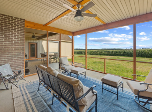 Screened in porch on the back of a house